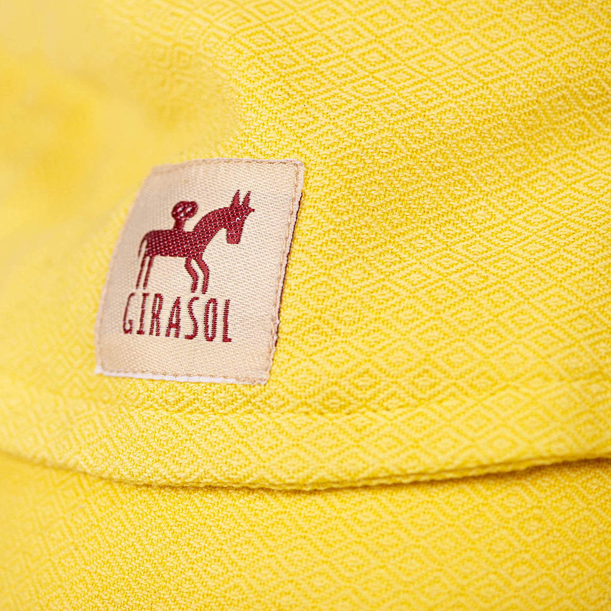 Fresh Marigold Kopfstütze Detail mit Girasol Logo